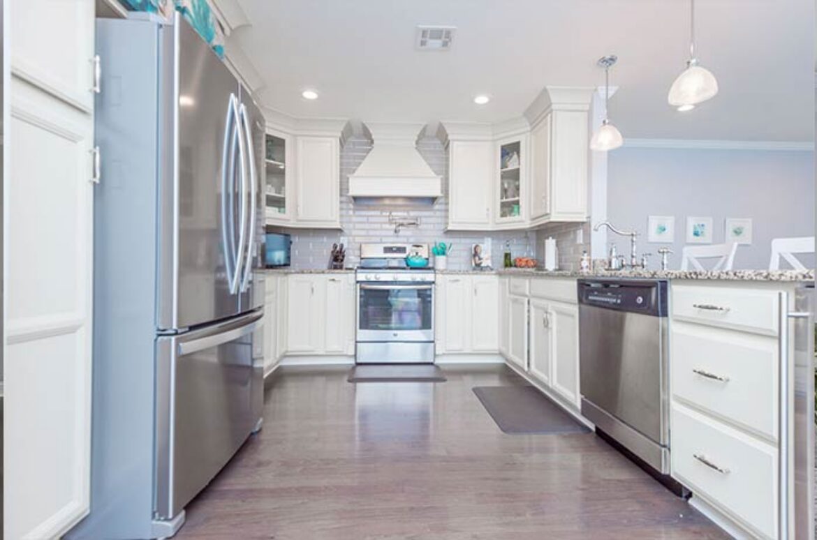 Modern kitchen with stainless steel appliances.