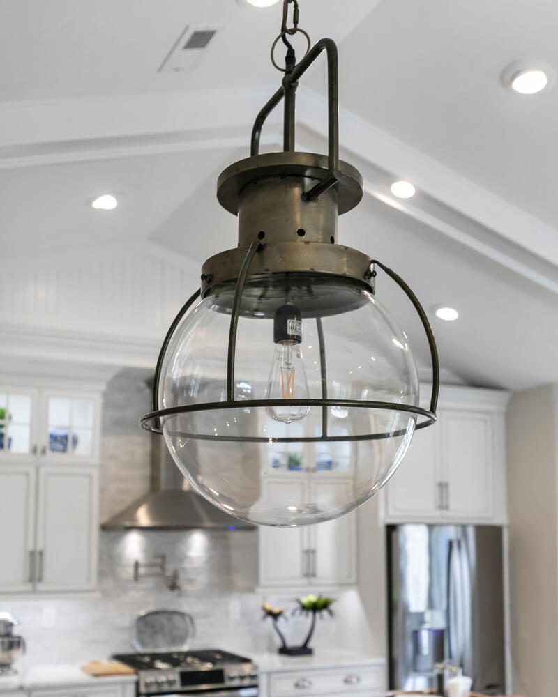 Ornate glass globe pendant light fixture.