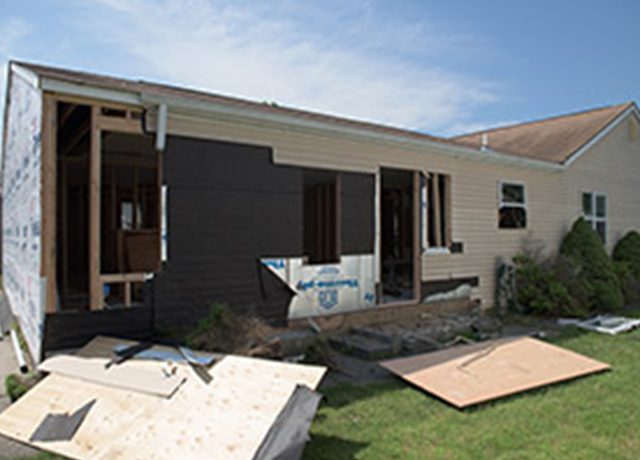 Home under construction with plywood.