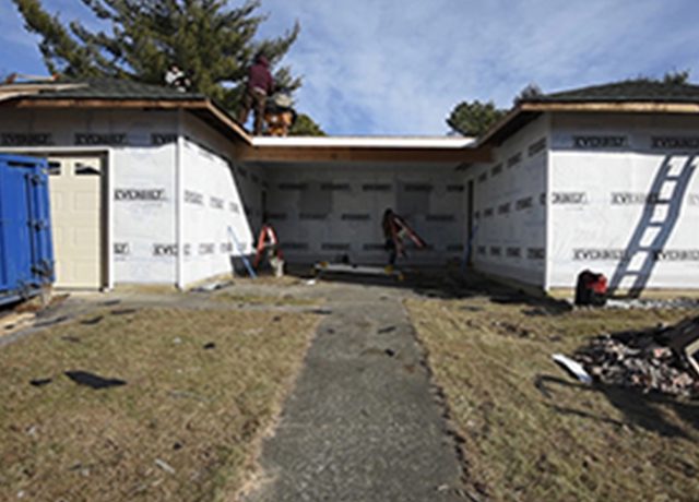 Construction workers building a new home.