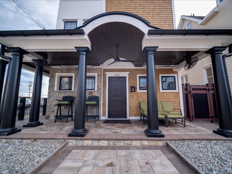 House entrance with porch and columns.