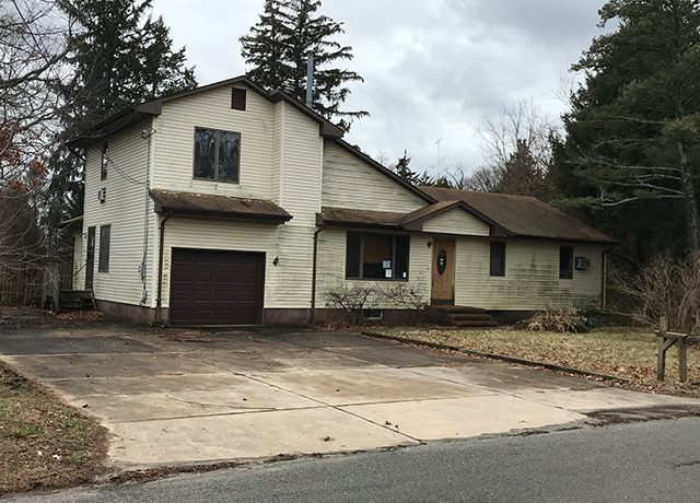 A suburban house with a driveway.