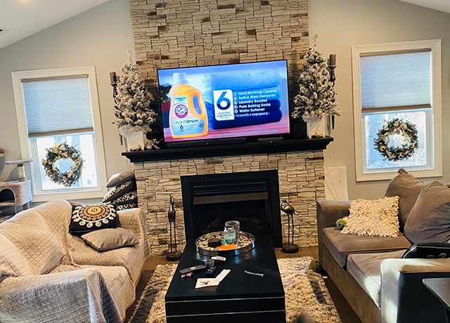 Living room with fireplace and TV.