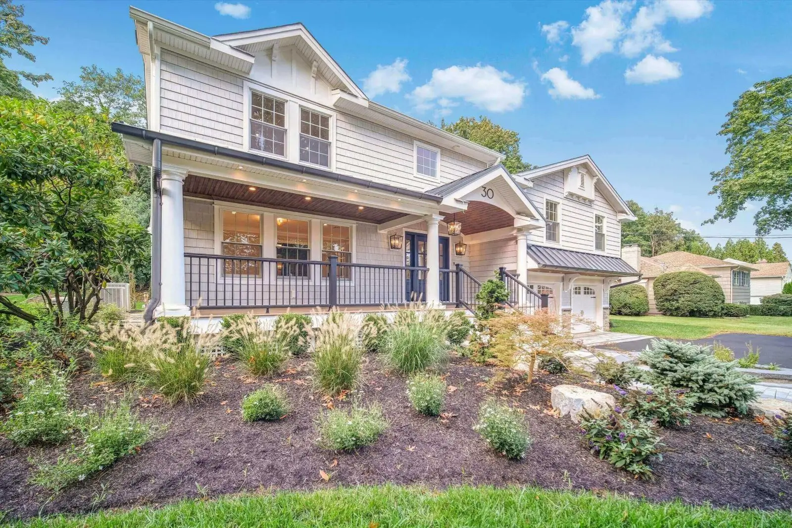Charming house with landscaped front yard.