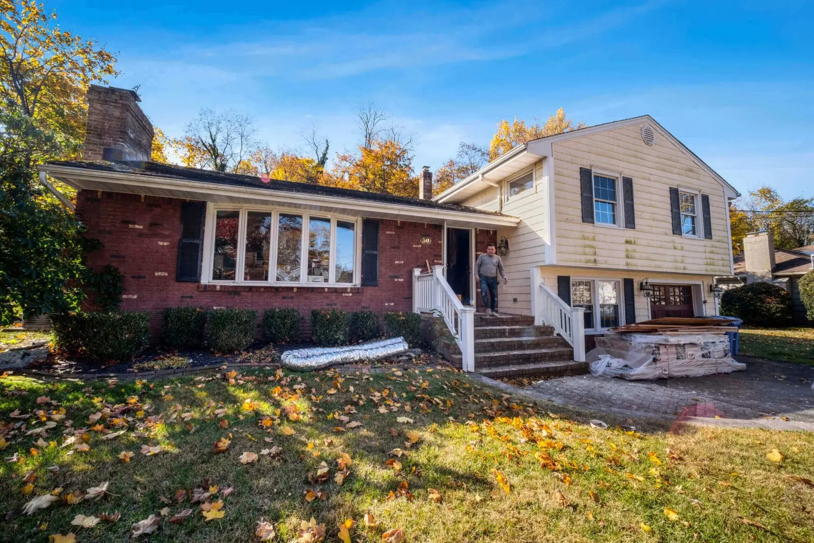 Renovating a home with autumn leaves nearby.
